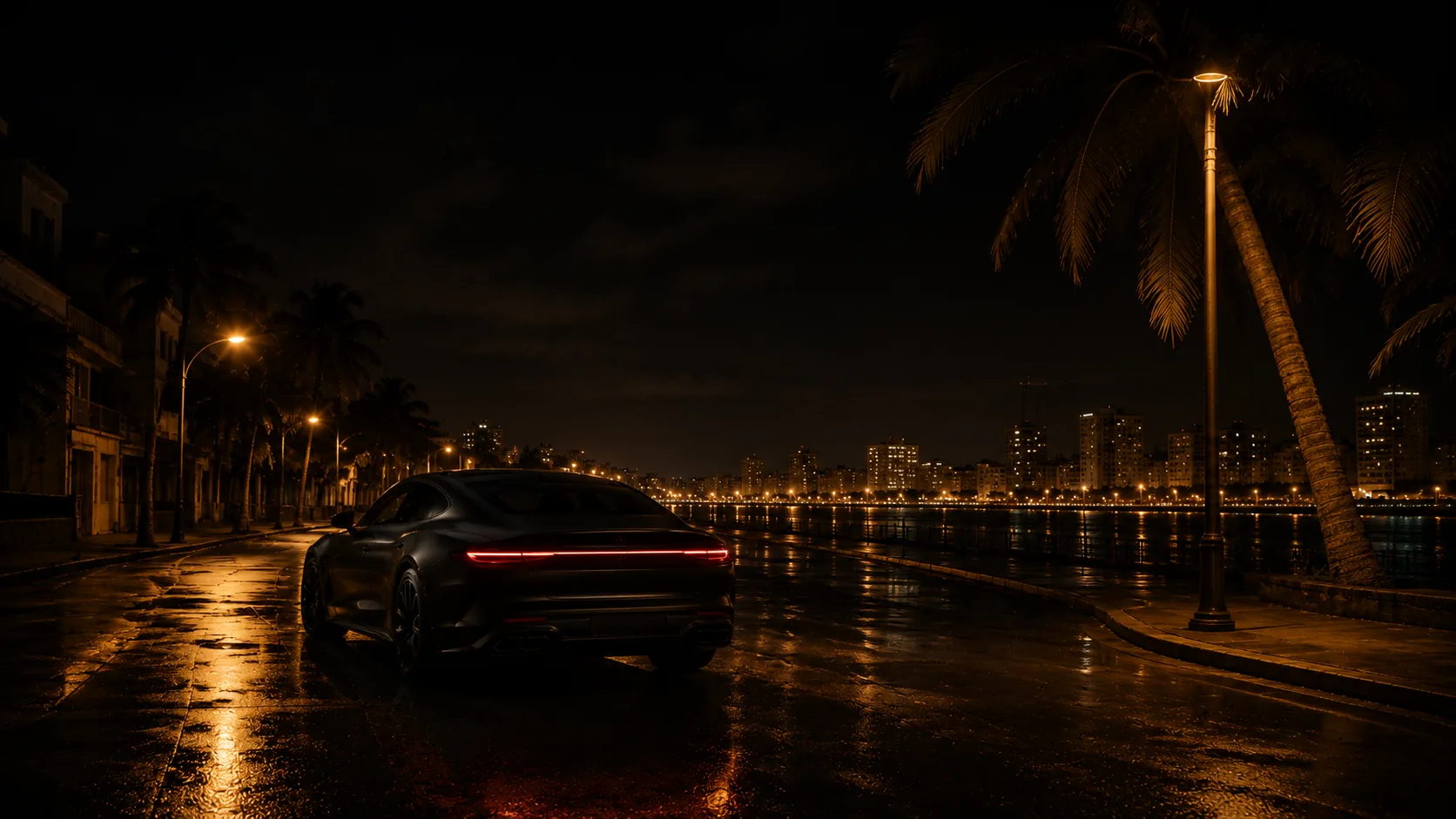 A dark sedan on a wet seaside boulevard at night, city lights across the bay